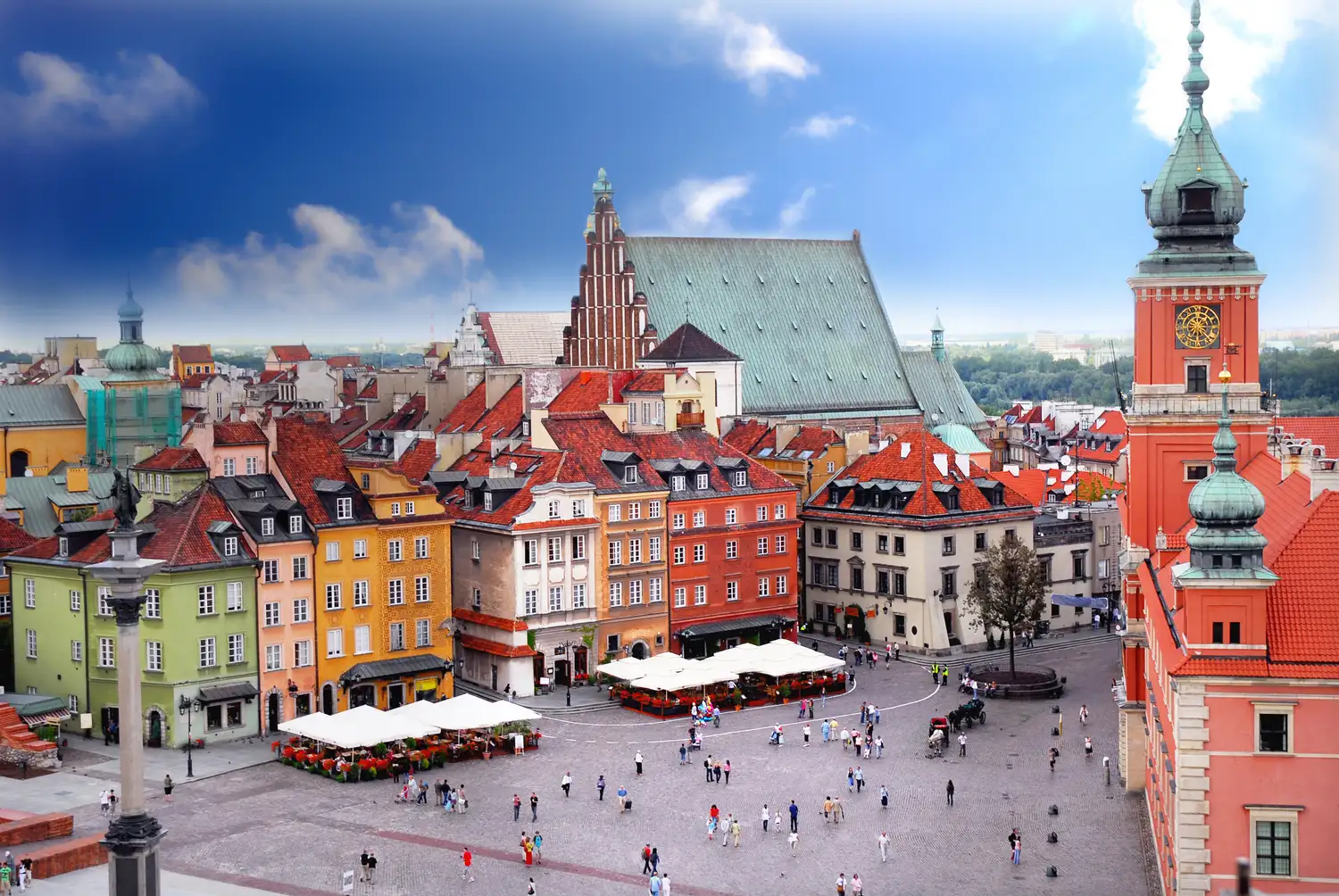 Warsaw Old Town Market Square with colorful buildings and clock tower