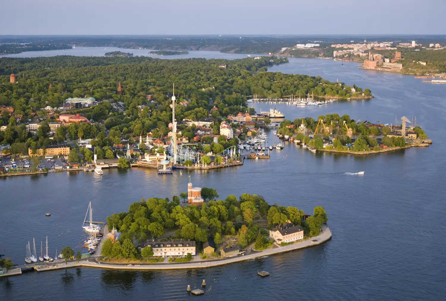 Stockholm aerial view of islands with amusement park, marina, and residential buildings> </div>
                        <div class=